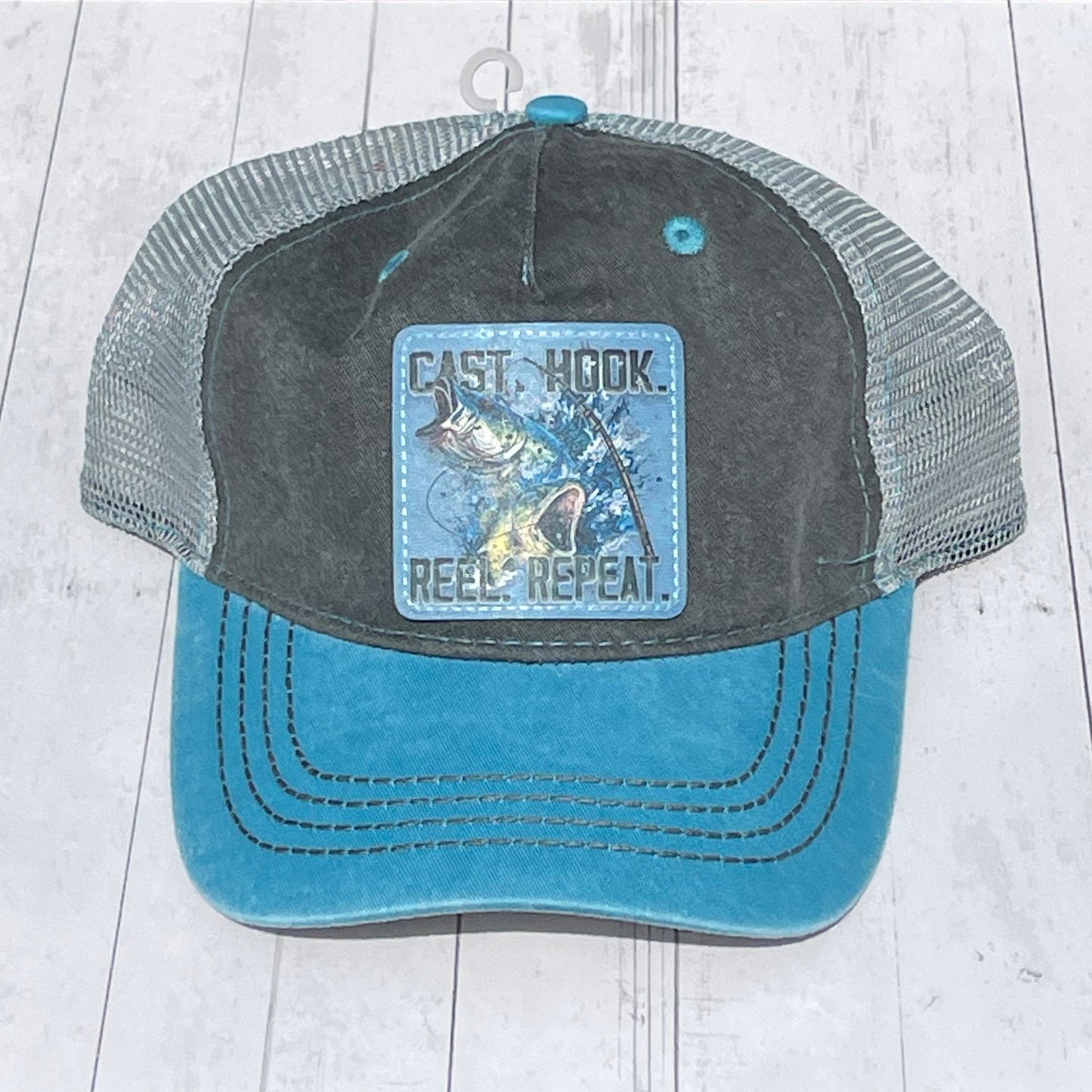 Blue and Gray Mesh Trucker Cap Cast Hook Reel Repeat Vegan Leather Patch